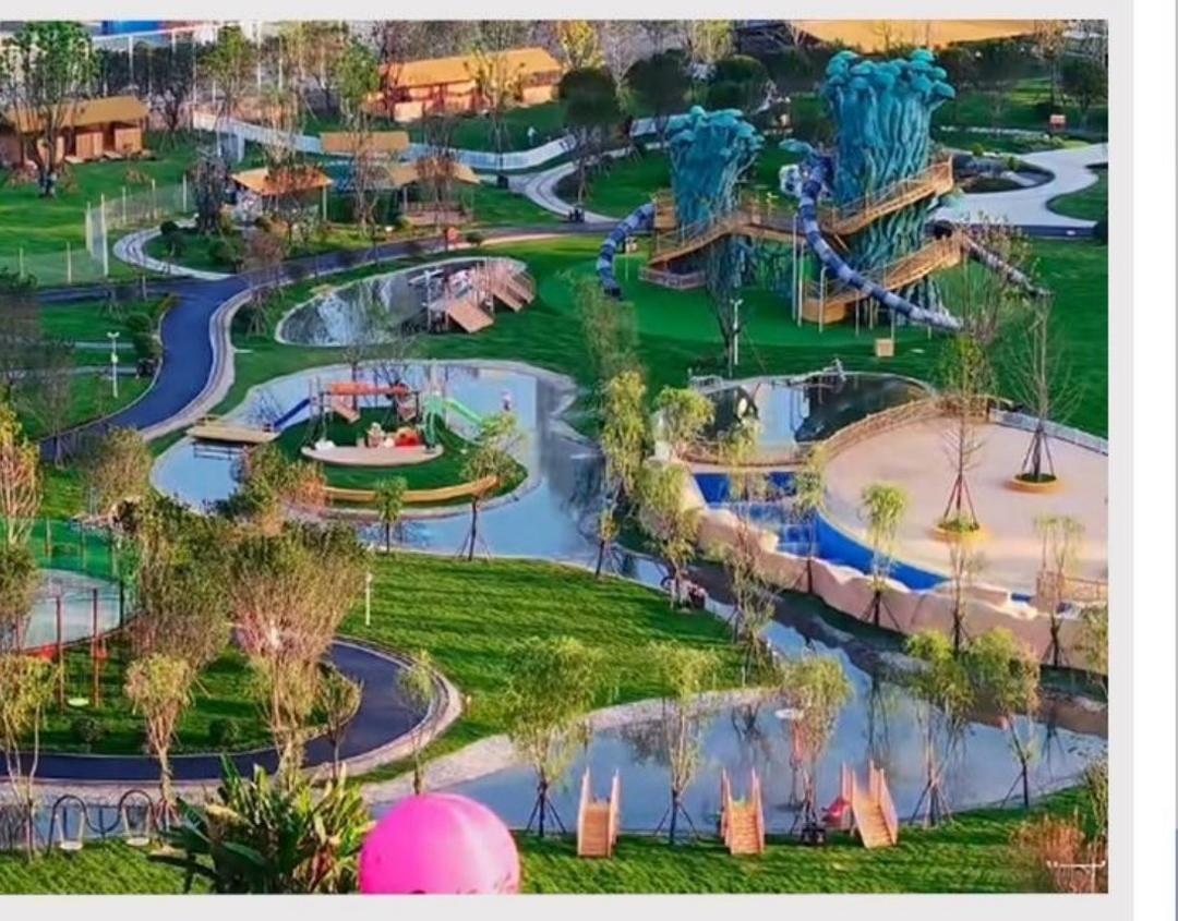 Aerial photograph of Fengqigu themed park in Chengdu with slides, water play and landscape play areas