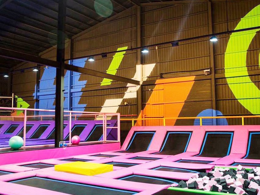 Trampoline park jump courts with guests bouncing