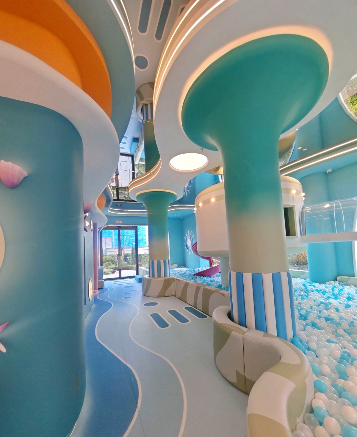 Ocean themed ball pit hall with mushroom columns and wave floors