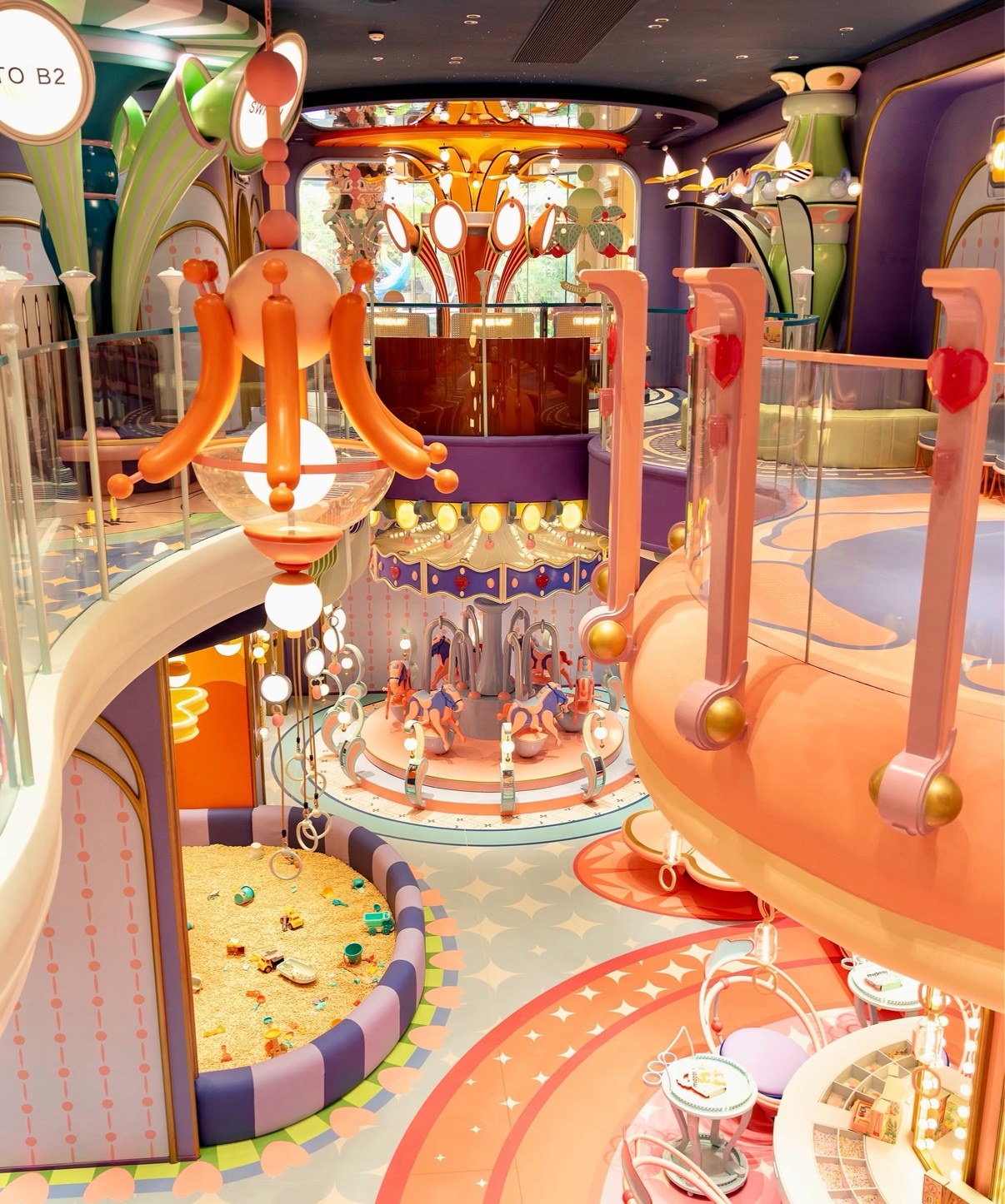 Ornate carousel ride inside a themed play hall