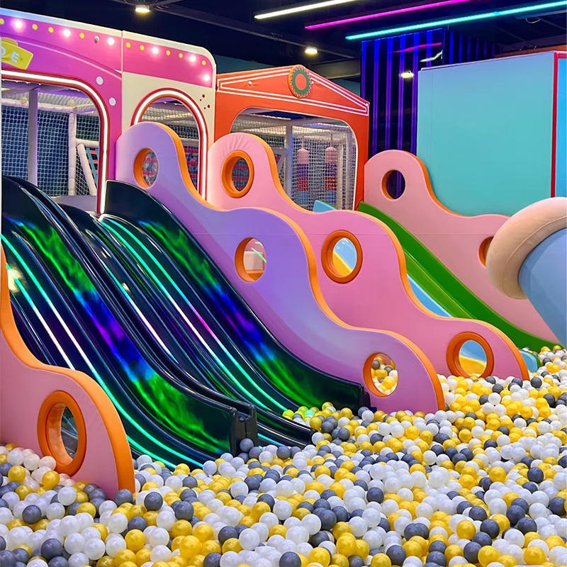 Wide illuminated wave slide in rainbow colours